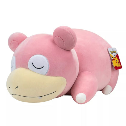 Pink Slowpoke Pokemon plush resting on its stomach with closed eyes