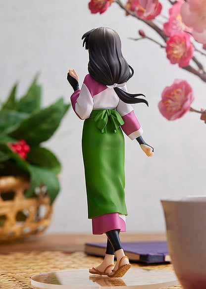 Inuyasha POP UP PARADE Sango figure with dark hair tied back wearing a pink and white top green skirt with a bow and brown sandals standing near a plant and branch with pink flowers