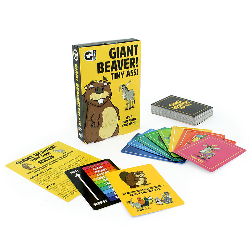 Close-up of Giant Beaver! Tiny Ass! game cards spread out with box