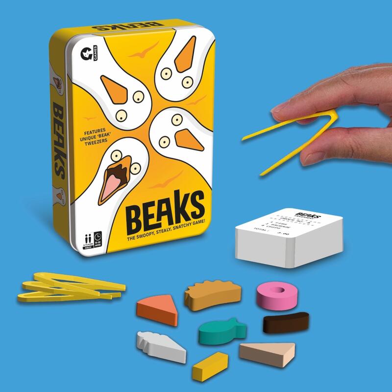 Beaks board game in a yellow tin featuring goose heads with beak-shaped yellow tweezers and various colorful food tokens spread on a blue surface