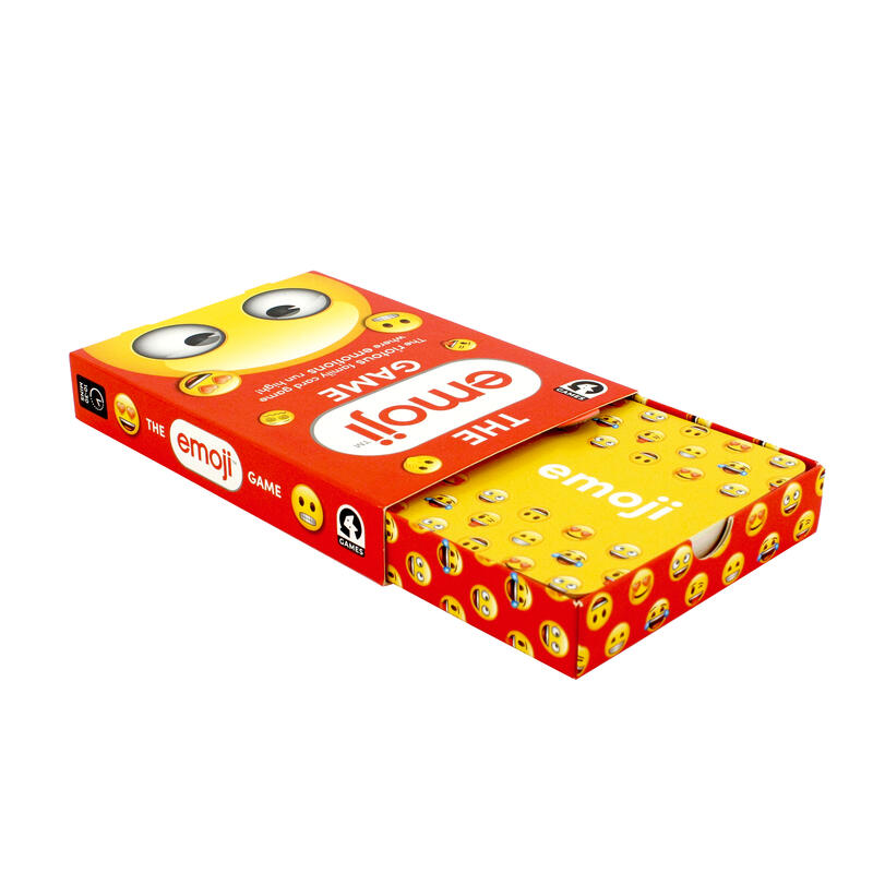 The Emoji Game in a red box with yellow cards overflowing featuring expressive cartoon eyes on the box top and multiple small emoji faces on the cards and box