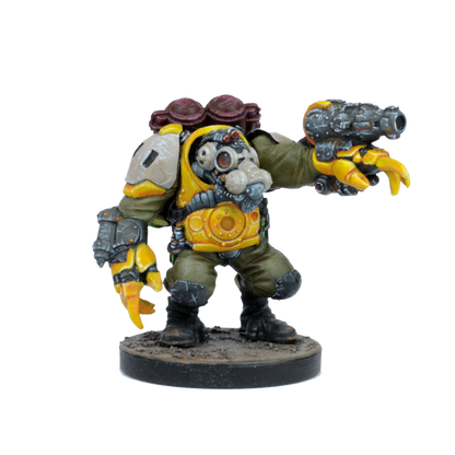 A painted sci-fi miniature of a bulky figure in yellow armor with a gas mask, holding a blaster and a claw