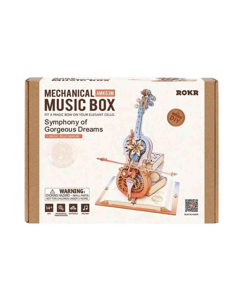 Packaging for a ROKR mechanical music box kit, featuring a wooden cello puzzle with visible gears standing on an open book