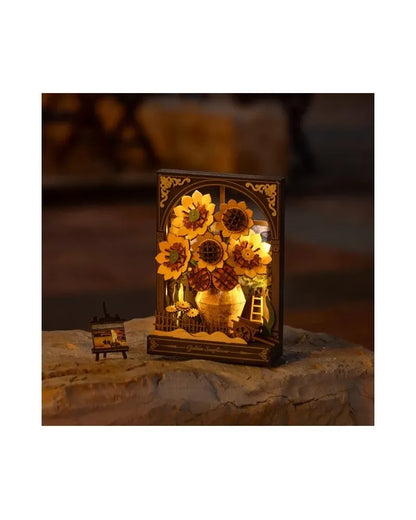 Illuminated wooden diorama of sunflowers in a vase, displayed with a miniature easel