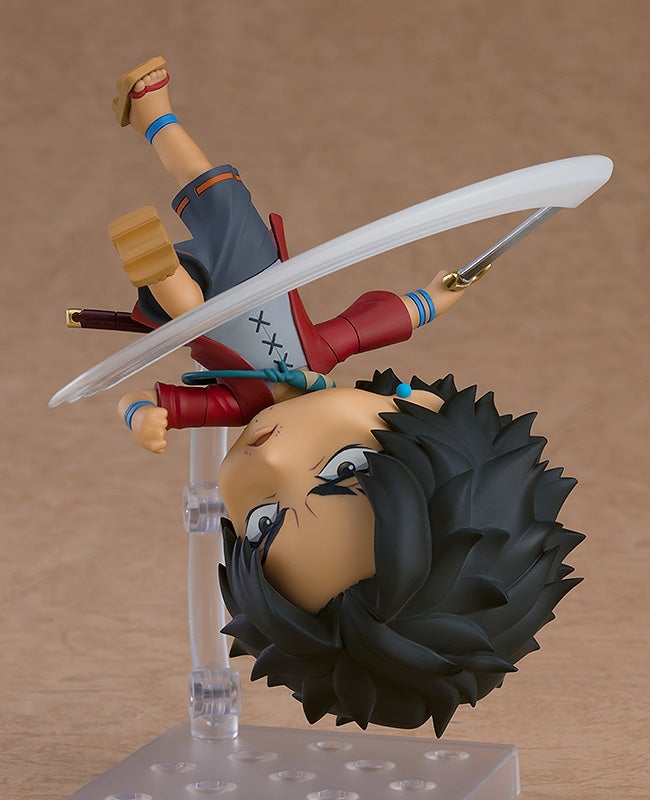 Anime action figure in mid-air with sword in hand and spiky black hair