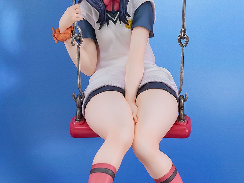 Anime figure on a swing with white shirt dark shorts and pink and black socks