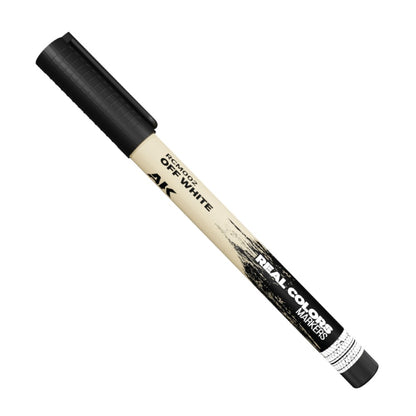 An off-white Real Colors marker pen with a black cap and tip, labeled 'RCM002 OFF WHITE'