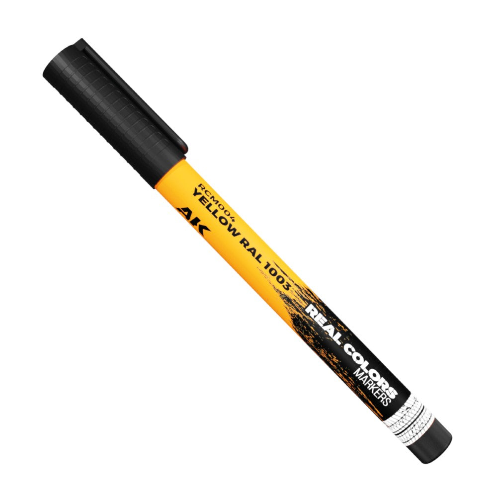 A yellow and black marker pen labeled "YELLOW RAL 1003" and "REAL COLORS MARKERS."
