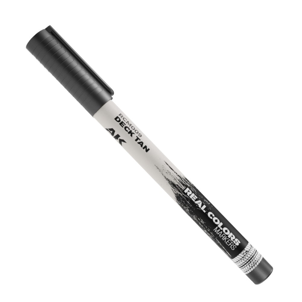 Black and white 'AK Real Colors Deck Tan' marker, angled diagonally on a white background