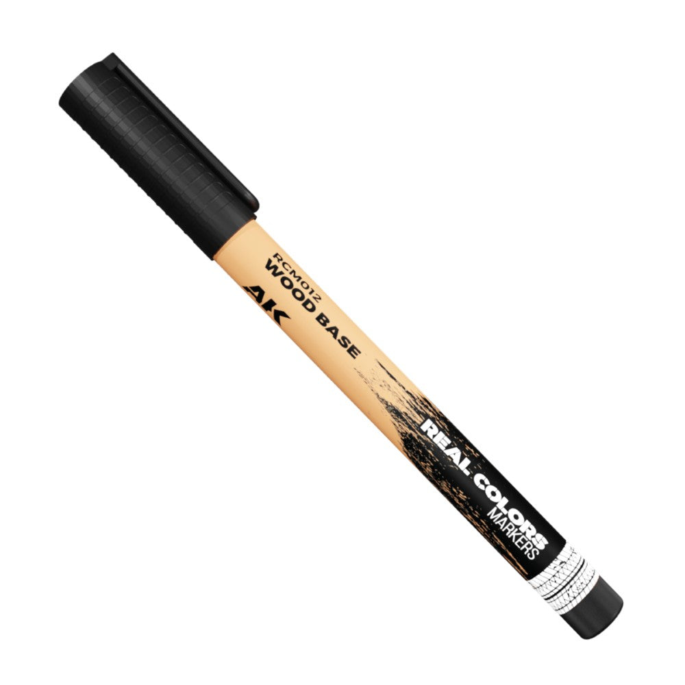 A beige AK brand marker with a black cap, labeled "WOOD BASE" and "REAL COLORS MARKERS"