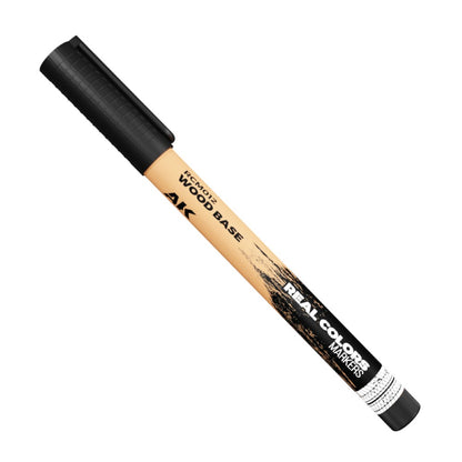 A beige AK brand marker with a black cap, labeled "WOOD BASE" and "REAL COLORS MARKERS"