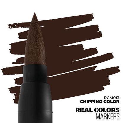 A dark brown brush marker tip creates textured dark brown strokes on a white background