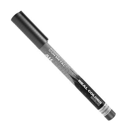 A dark gray AK Real Colors Gun Metal marker pen, featuring a distinct diamond plate pattern on its body