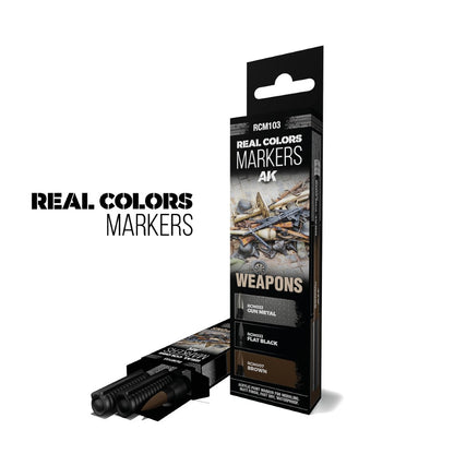 Real Colors AK Weapons paint markers set. Two boxes, one open showing three markers in Gun Metal, Flat Black, and Brown