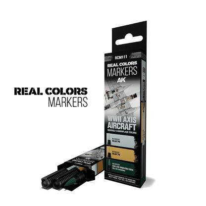 Two green AK Real Colors markers emerge from an open box, next to an upright box for WWII Axis Aircraft camouflage