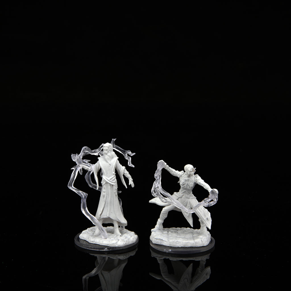 Two unpainted WizKids Critical Role miniatures: a robed male cultist and a dynamic female chosen, both with translucent magical effects, stand on a reflective black surface