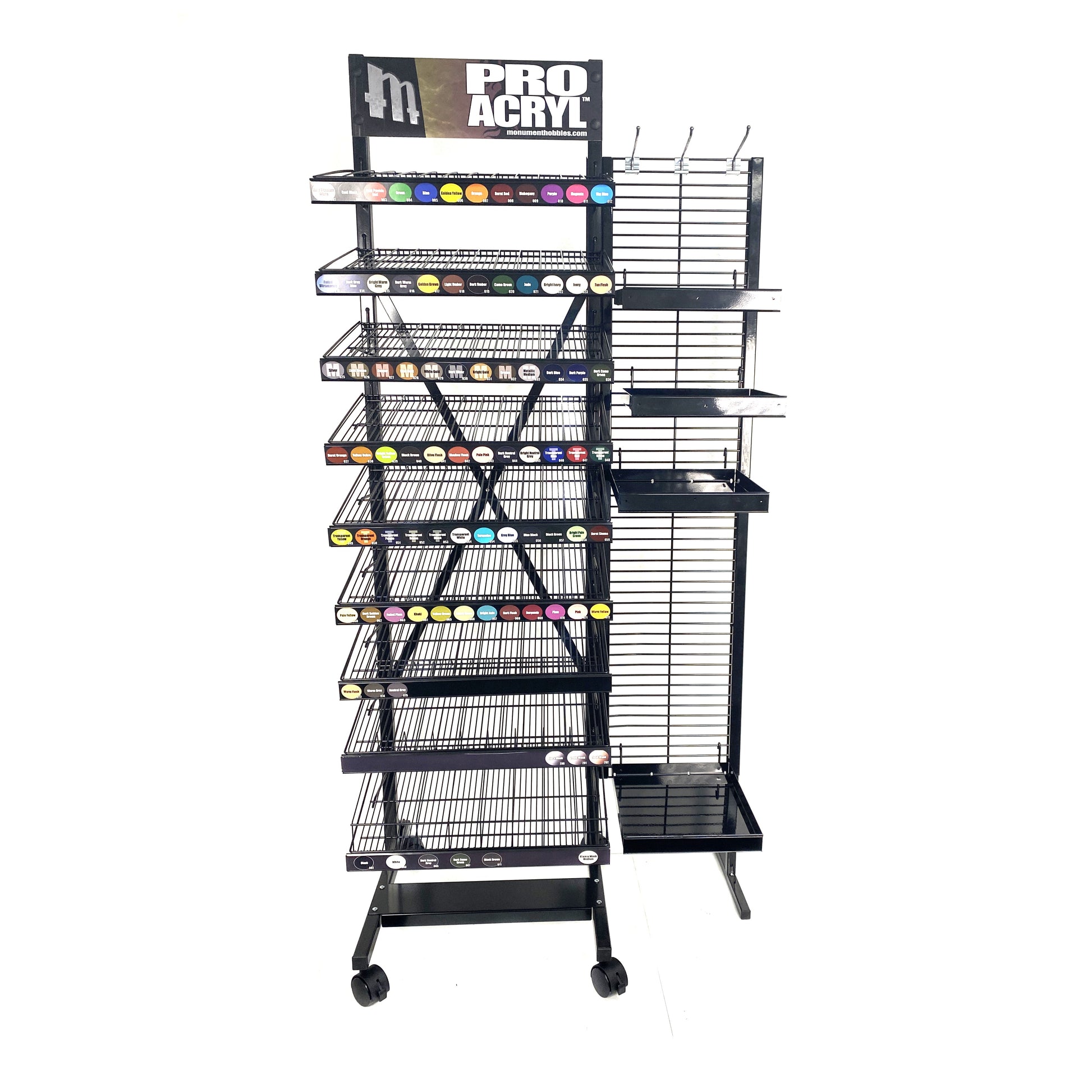 A black metal display rack for PRO ACRYL paints, featuring numerous colour swatches and empty shelves, on a white background.