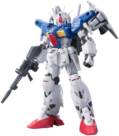 White and blue Gundam Mobile Suit model holding a rifle, standing on a white background