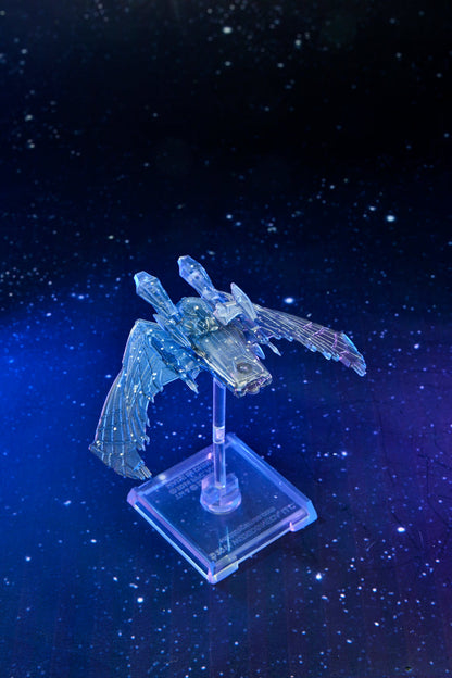 A translucent, winged starship model displayed on a stand, glowing blue against a dark, starry space