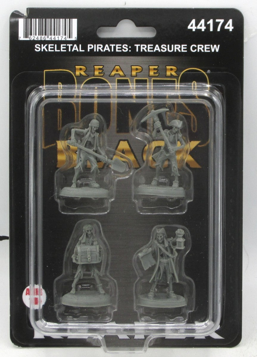 A blister pack displays four grey Skeletal Treasure Crew miniatures, including pirates with a shovel, pickaxe, treasure chest, and a map with a lantern