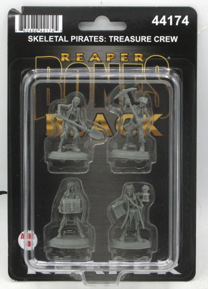 A blister pack displays four grey Skeletal Treasure Crew miniatures, including pirates with a shovel, pickaxe, treasure chest, and a map with a lantern