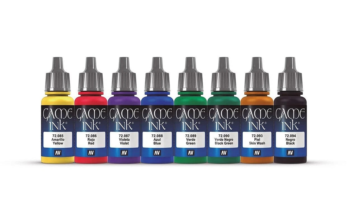Eight colourful Vallejo Game Ink dropper bottles, from yellow to black, arranged in a line on a white surface