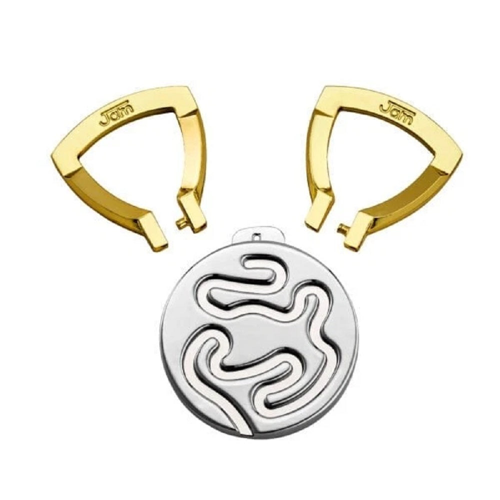 Two gold "Jam" clips and a round silver pendant with a winding, cutout maze design