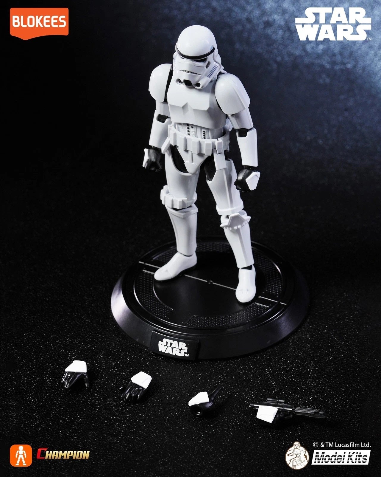 Detailed Star Wars Stormtrooper action figure standing on a base. Extra hands and a blaster rifle are visible below