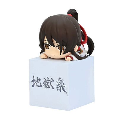 Chibi figure of Sagiri from Hell's Paradise in white and red outfit on a cube with Japanese writing