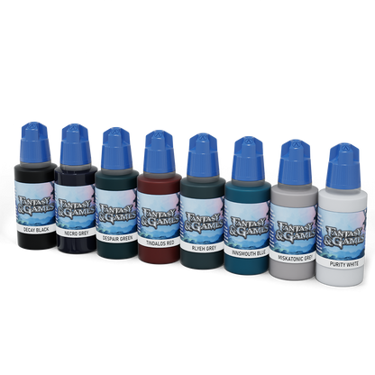 Eight paint bottles from the Shades Of Doom Paint Set are lined up, featuring various dark and neutral colors like black, grey, green, red, and blue, all with blue caps