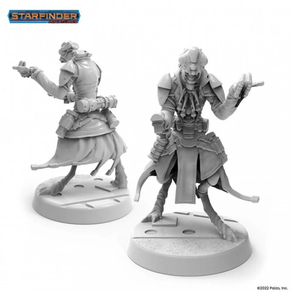 Two unpainted grey Starfinder Shirren Operative miniatures in dynamic poses