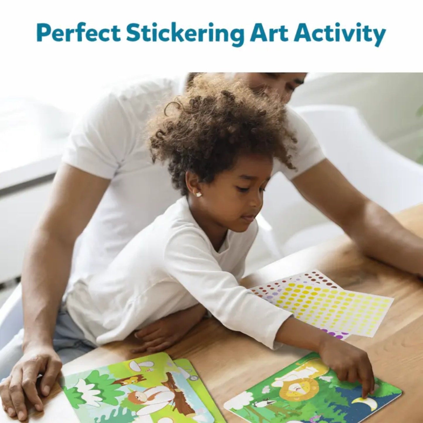 Young child and adult bonding over a sticker art activity, placing stickers onto animal scene cards