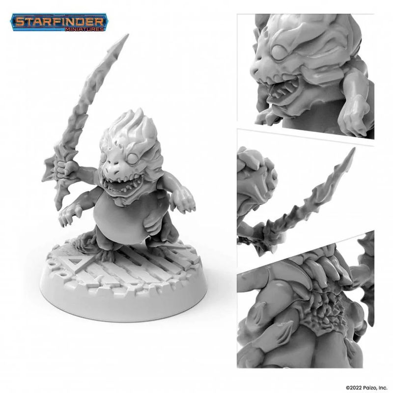 Grey Starfinder Skittermander miniature of a four-armed monster with sharp teeth and a spiky crest, holding a jagged sword