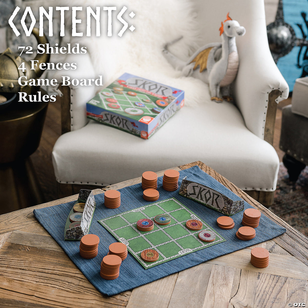 Players stacking shield pieces on the board during a game of Skor