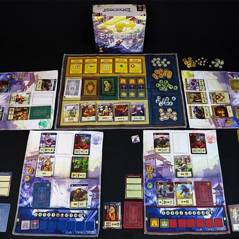 Snowcrest board game components displayed on black surface