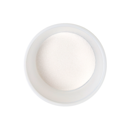 White granulated sugar in a round, light-coloured bowl, viewed from above.