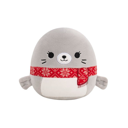 Cute gray plush seal wearing a red winter scarf patterned with white snowflakes
