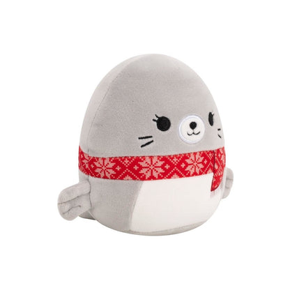 Round gray seal plush toy wearing a red scarf decorated with white snowflakes