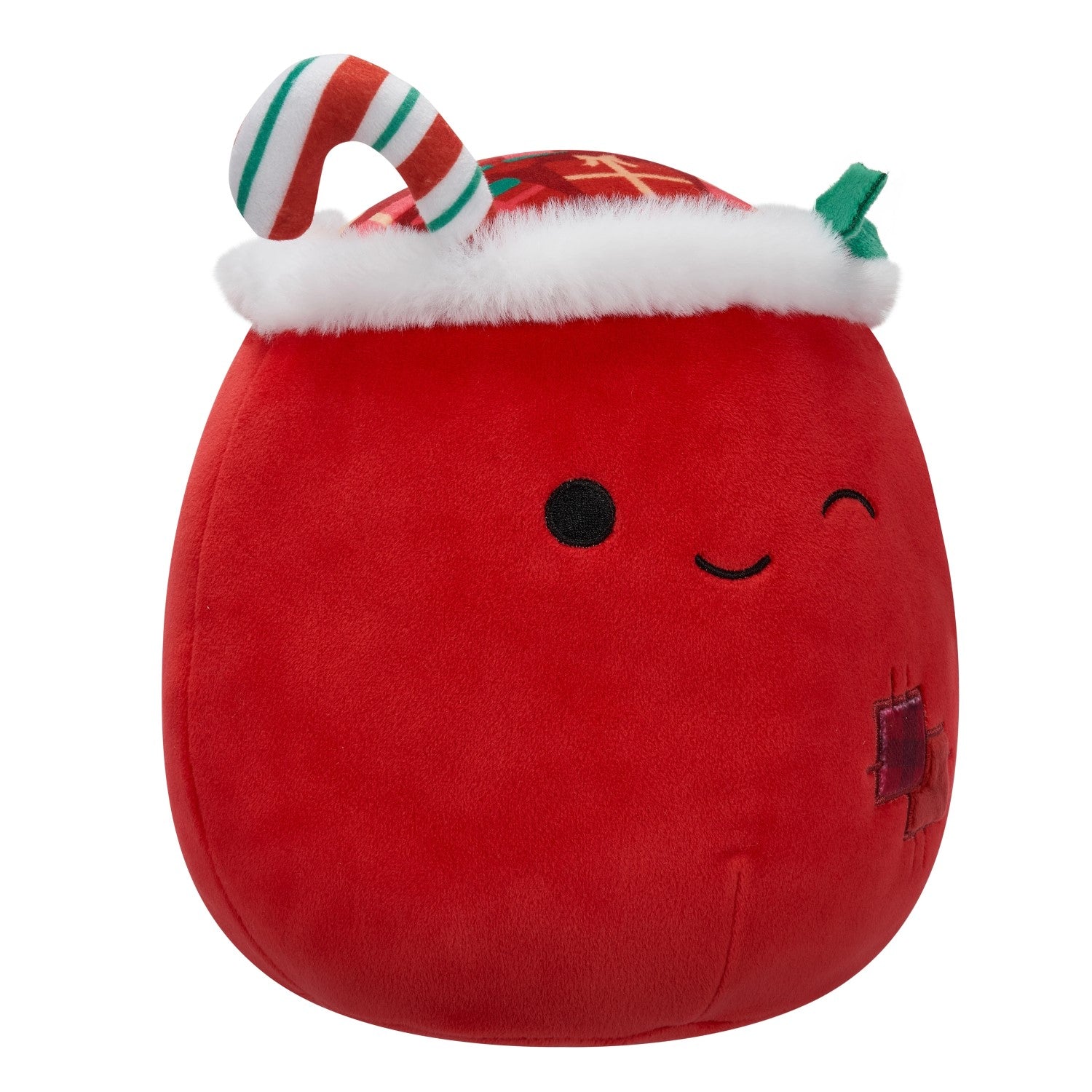 Red festive plush toy (Squishmallow style) with a winking face, wearing a fur-trimmed hat and candy cane attachment