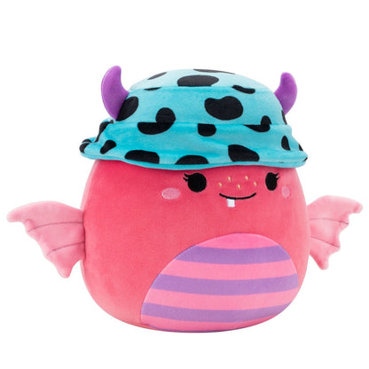 A 12-inch pink Halloween Squishmallow monster featuring a striped belly, small wings, one snaggletooth, and a teal spotted hat with purple horns