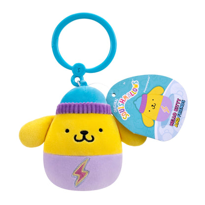 Yellow Pompompurin Squishmallow clip with blue beanie and purple base featuring a lightning bolt