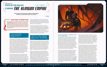 Two purple-skinned Klingons with ridged foreheads sit near a glowing orange console amidst a fiery background