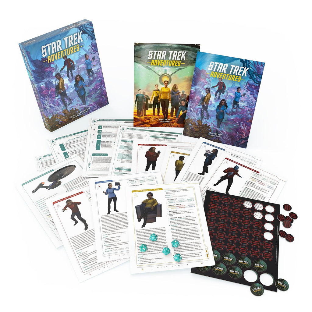 Star Trek Adventures RPG set laid out on a white surface, showing box, rulebooks, character sheets, tokens, and dice
