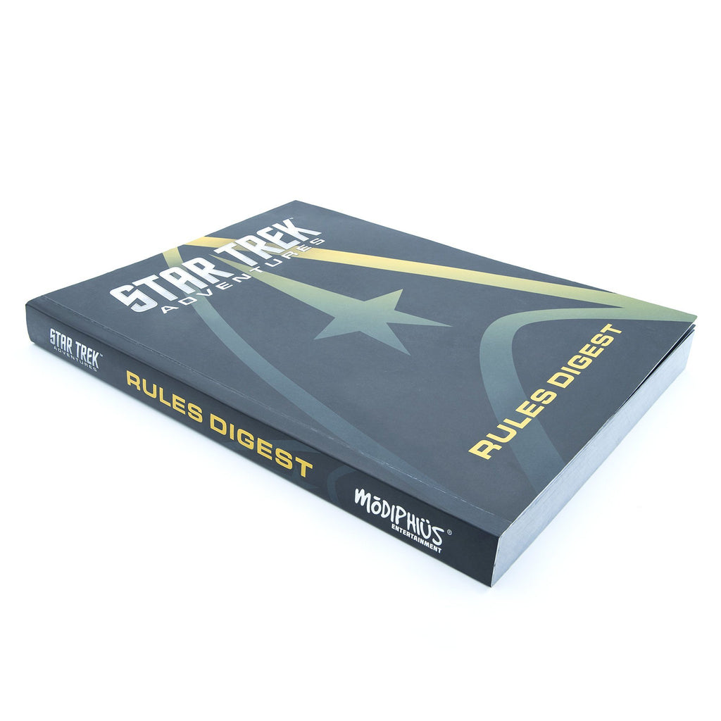Star Trek Adventures Rules Digest book, dark cover with gold Starfleet delta and text, displayed on a white background