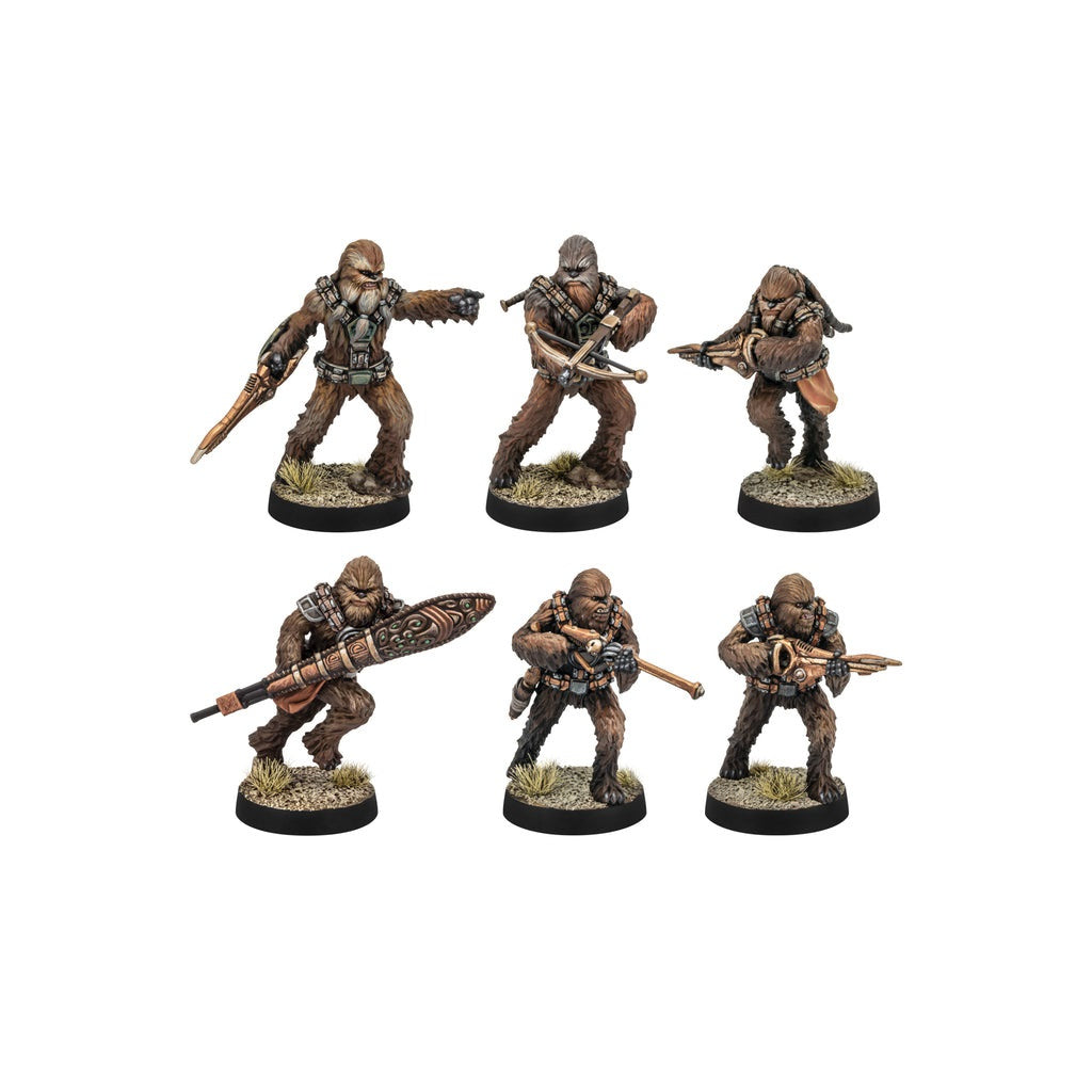 Six painted Wookiee-like tabletop miniatures in various combat poses, armed with heavy rifles and bowcasters