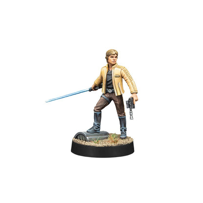 Luke Skywalker miniature figure holding a blue lightsaber and a blaster pistol