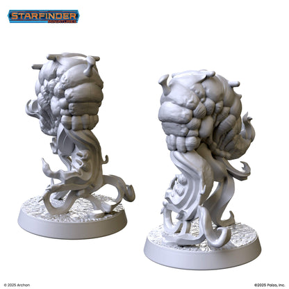 Two unpainted Starfinder miniatures of an alien creature with a bulbous body and swirling tendrils