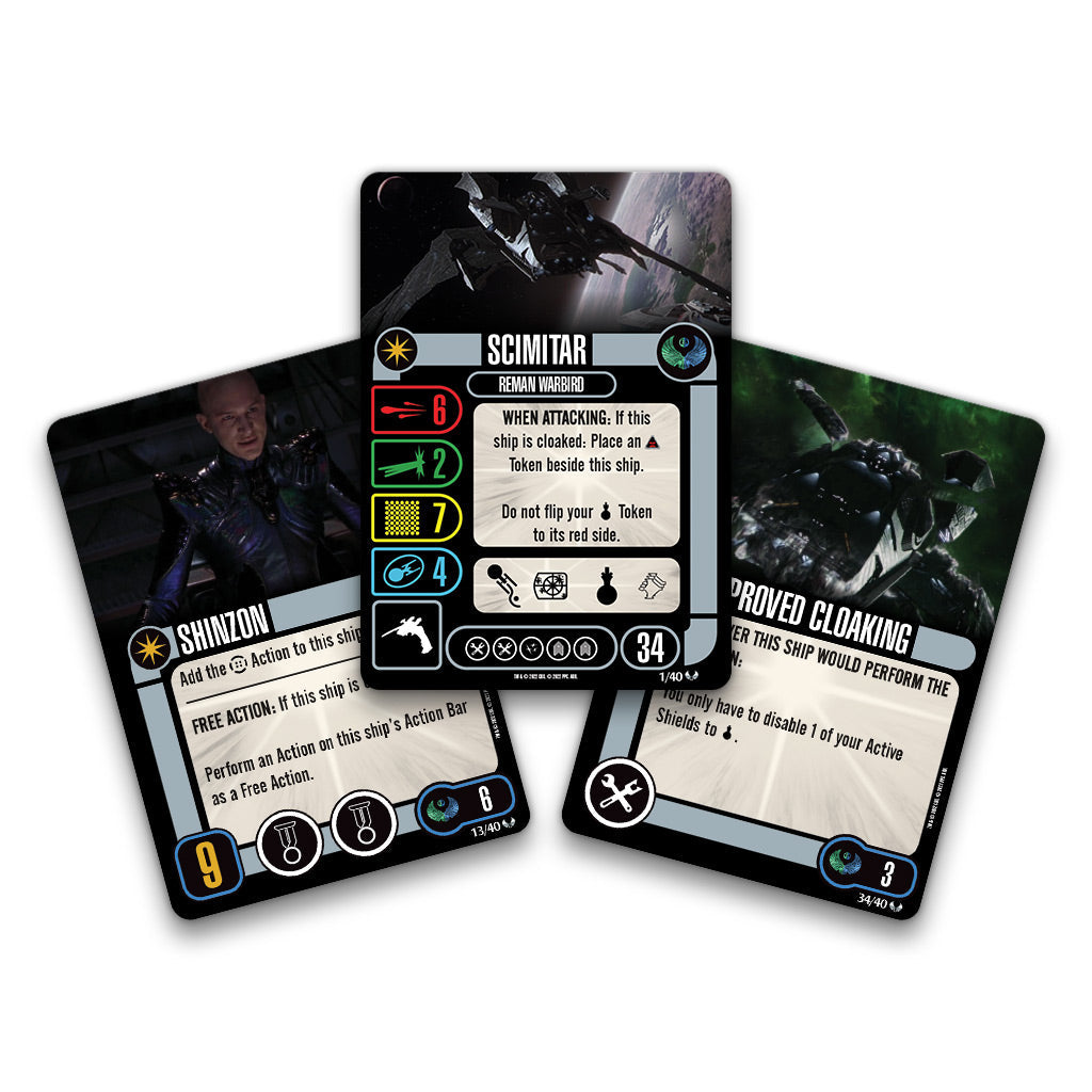 Three fanned Star Trek game cards. The central card shows the Scimitar ship, flanked by a Shinzon character card and a 'Proved Cloaking' card