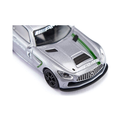 Close-up of a silver die-cast AMG race car model with green racing stripes and the number 4