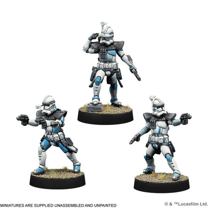Three painted Star Wars ARC Trooper tabletop miniatures, white and blue armor, holding blasters.